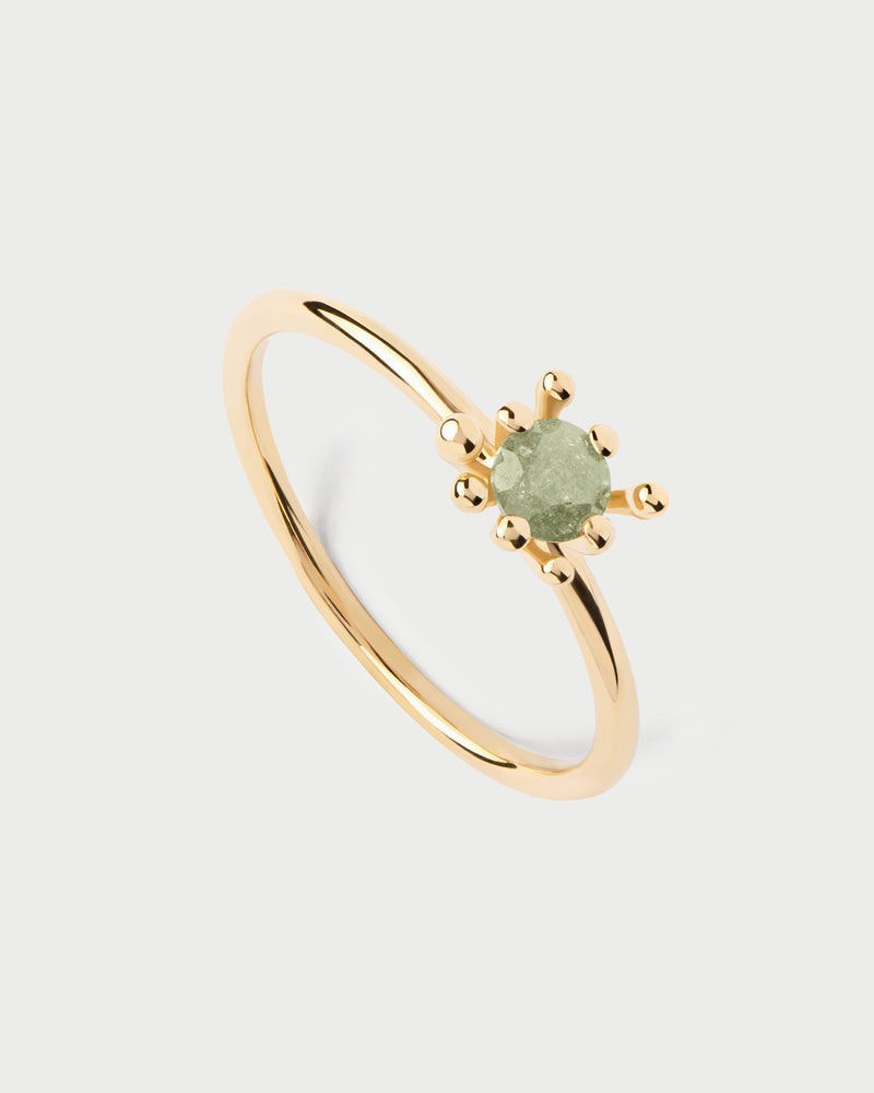 Gold-plated organic ring set with iced green zirconia surrounded by multi-prong setting