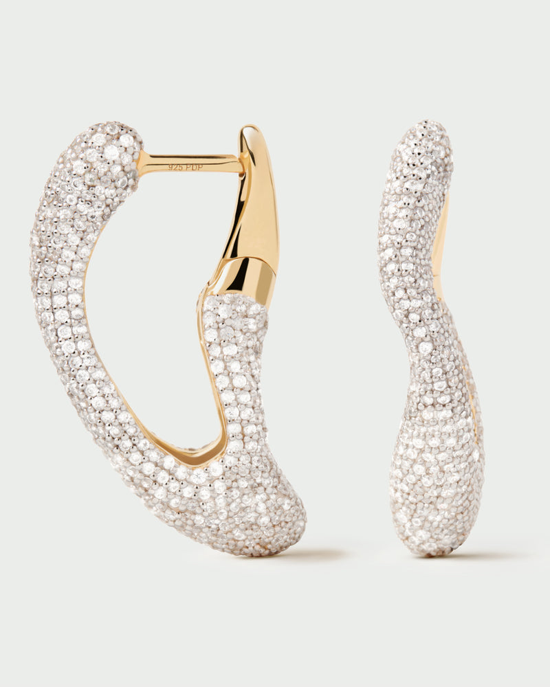 Gold-plated sculptural hoop earrings with abstract design set with pavé zirconia