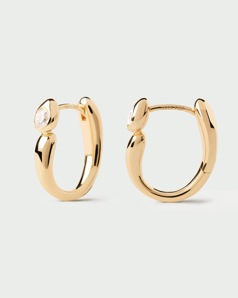 Gold-plated modern hoops accented with a round white zirconia