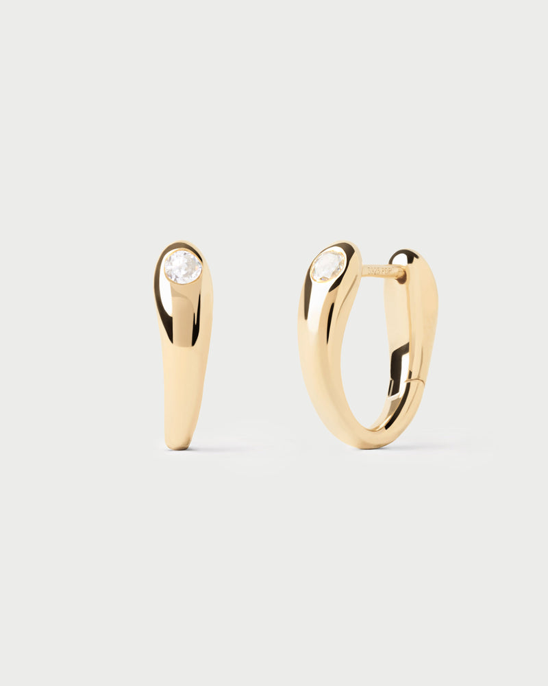 Modern hoop earrings topped with a round zirconia