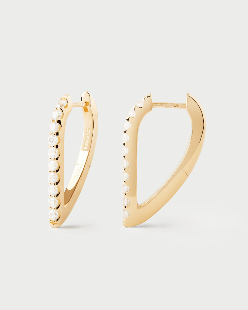 Geometric hoop earrings with oval shape and white zirconia