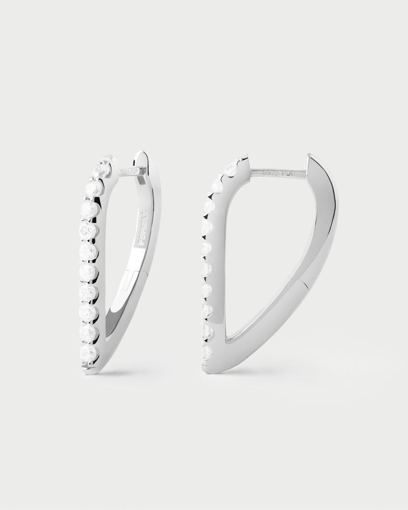 Silver geometric hoop earrings with oval shape and white zirconia