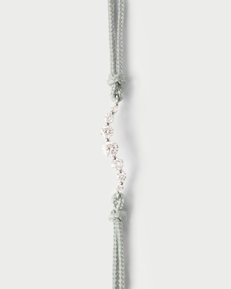 Adjustable diamond cord bracelet featuring a row of lab-grown diamonds in graduating sizes