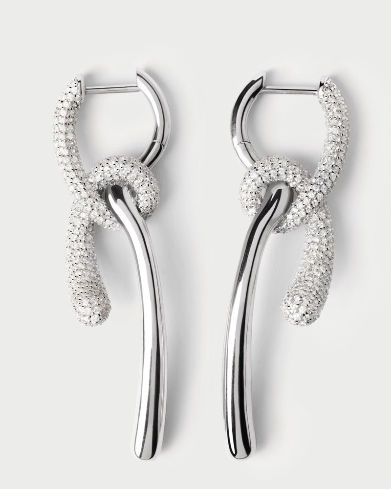 Elegant silver asymmetric hoop earrings with contrasting pavé zirconia knotted pendants