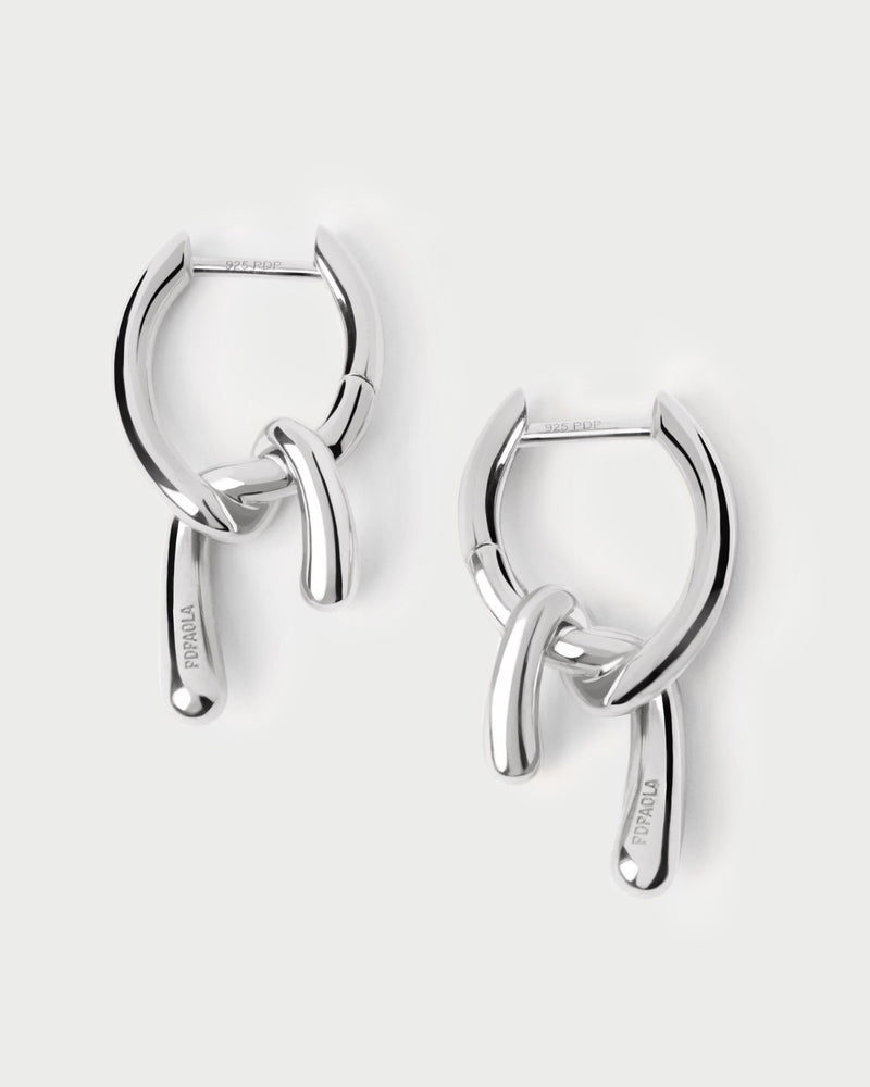 Small silver asymmetric hoop earrings with fluid knotted pendants