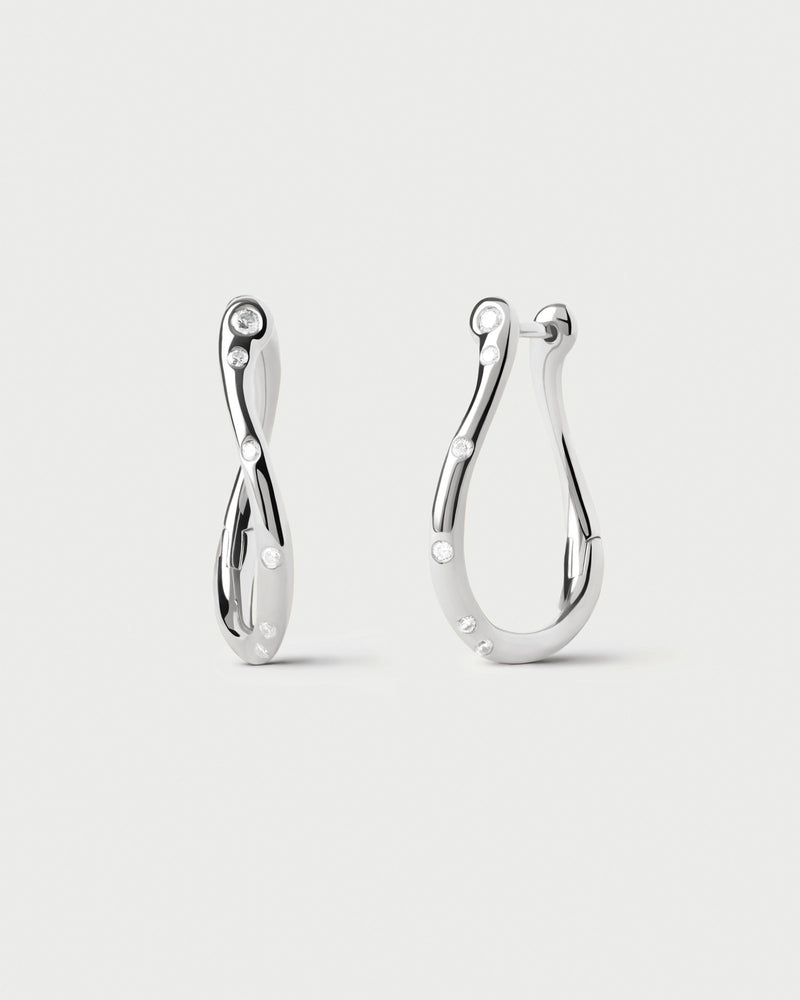 Small wavy silver hoop earrings adorned with sparkling zirconia accents