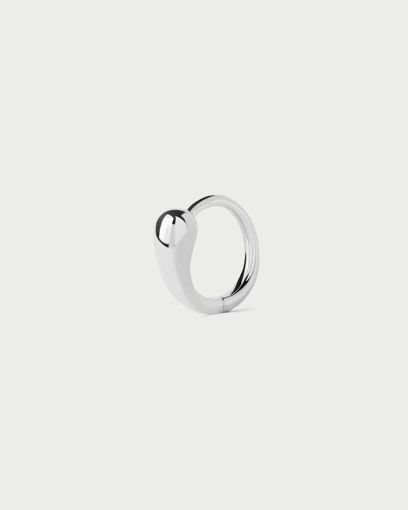 Mini silver single huggie hoop featuring sculptural drop-shaped motif and hidden closure