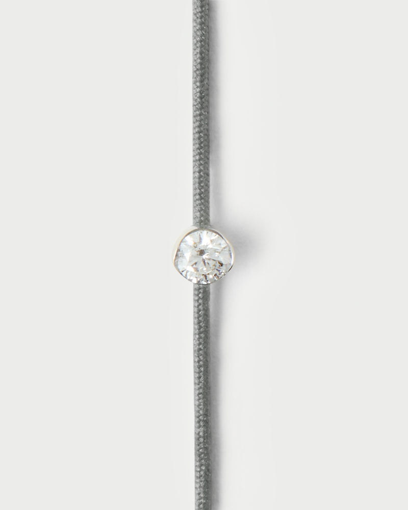 Adjustable diamond cord bracelet featuring a round lab-grown diamond