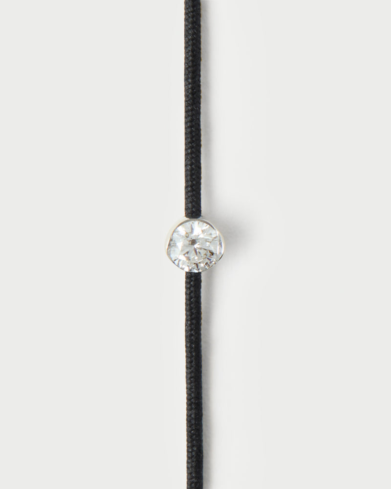 Adjustable diamond cord bracelet featuring a round lab-grown diamond