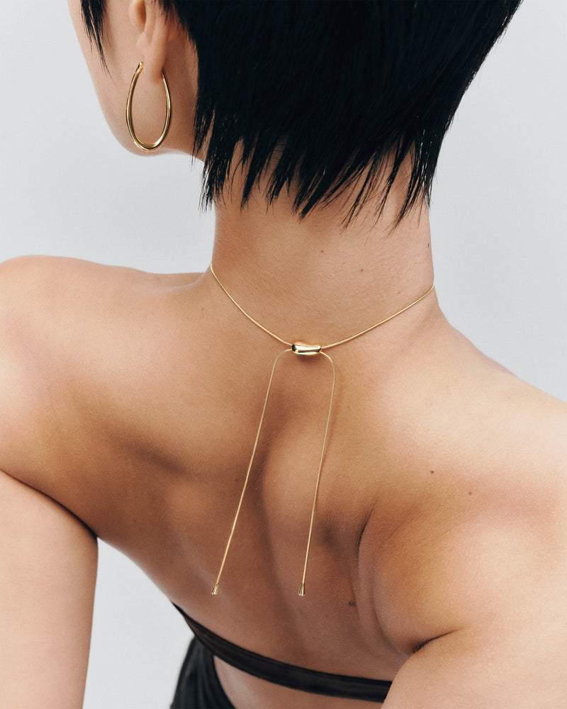 Modern choker necklace with an adjustable drop pendant