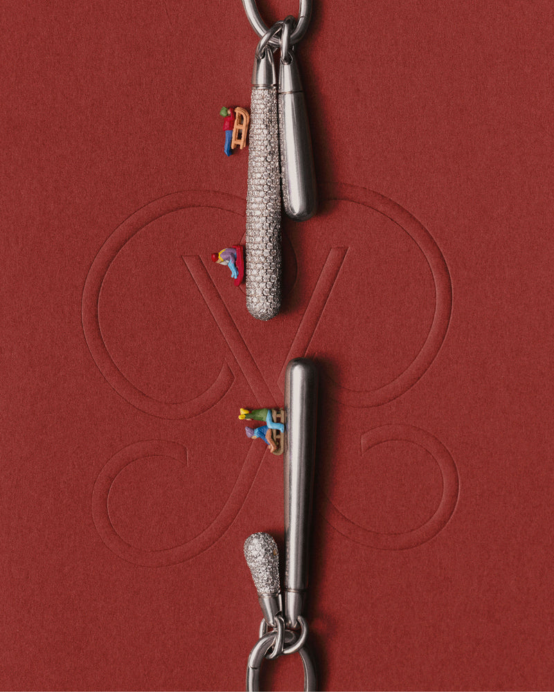 Silver single hoop with a long drop pendant