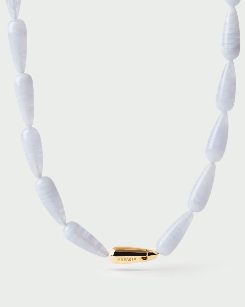 Modern choker featuring blue gemstone beads and signature drop closure