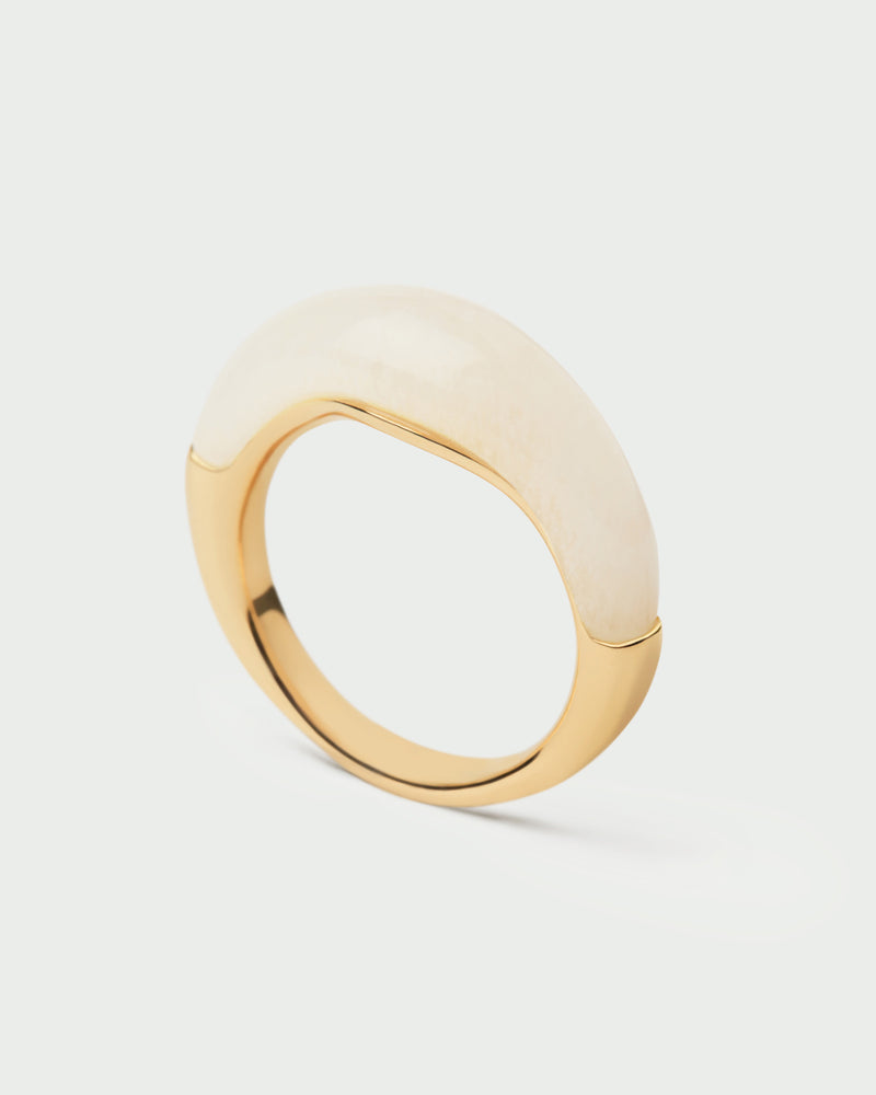 Gold-plated fluid stamp ring topped with a hand-carved white gemstone