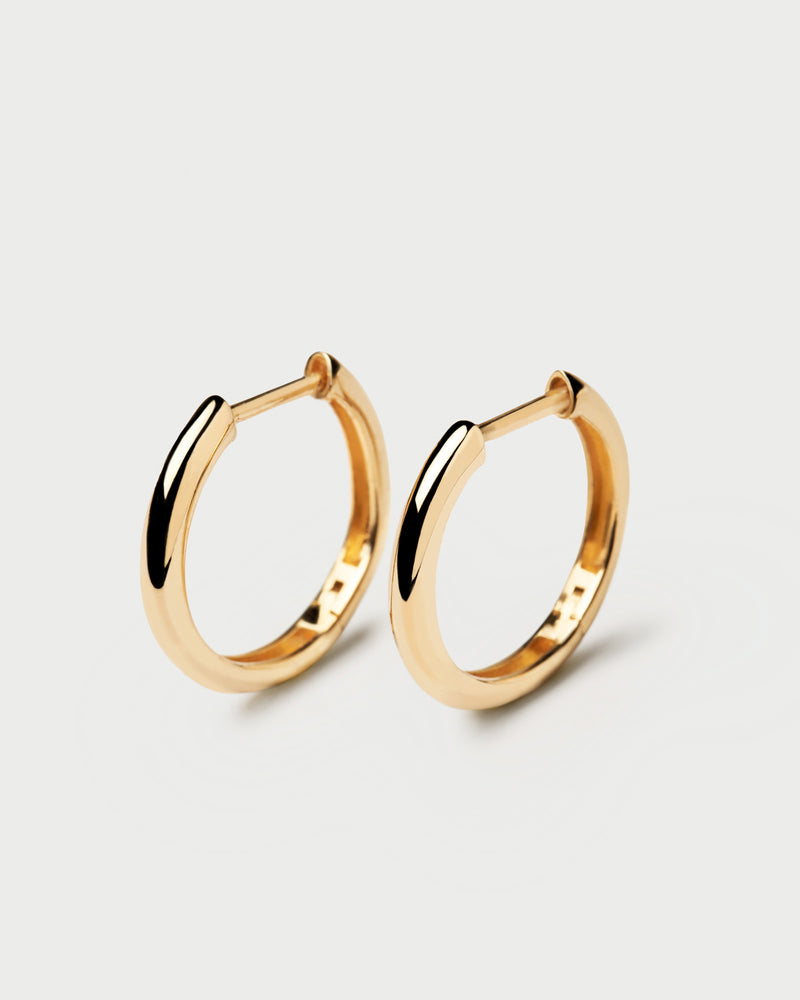 Plain solid yellow gold hoops made of recycled gold