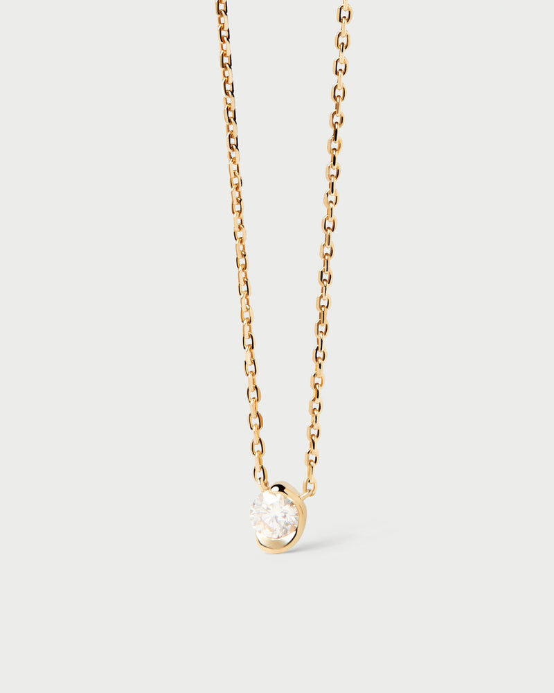 Dainty 18K yellow gold solitary necklace with a half-bezel set lab-grown diamond