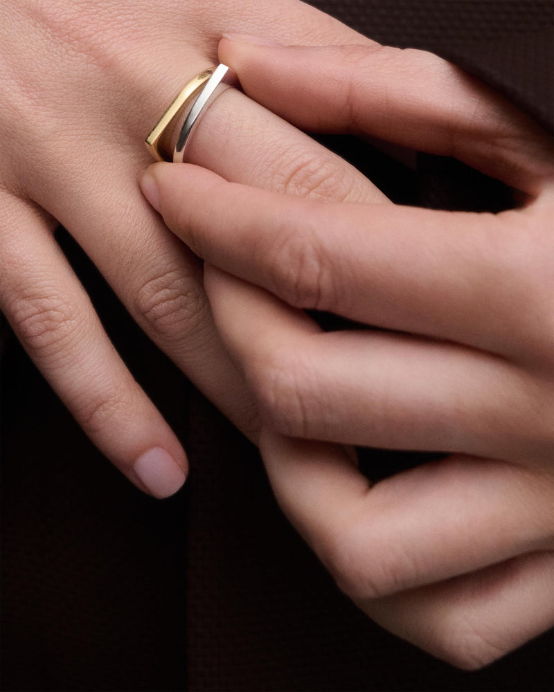 Silver geometric ring with asymmetric round shape