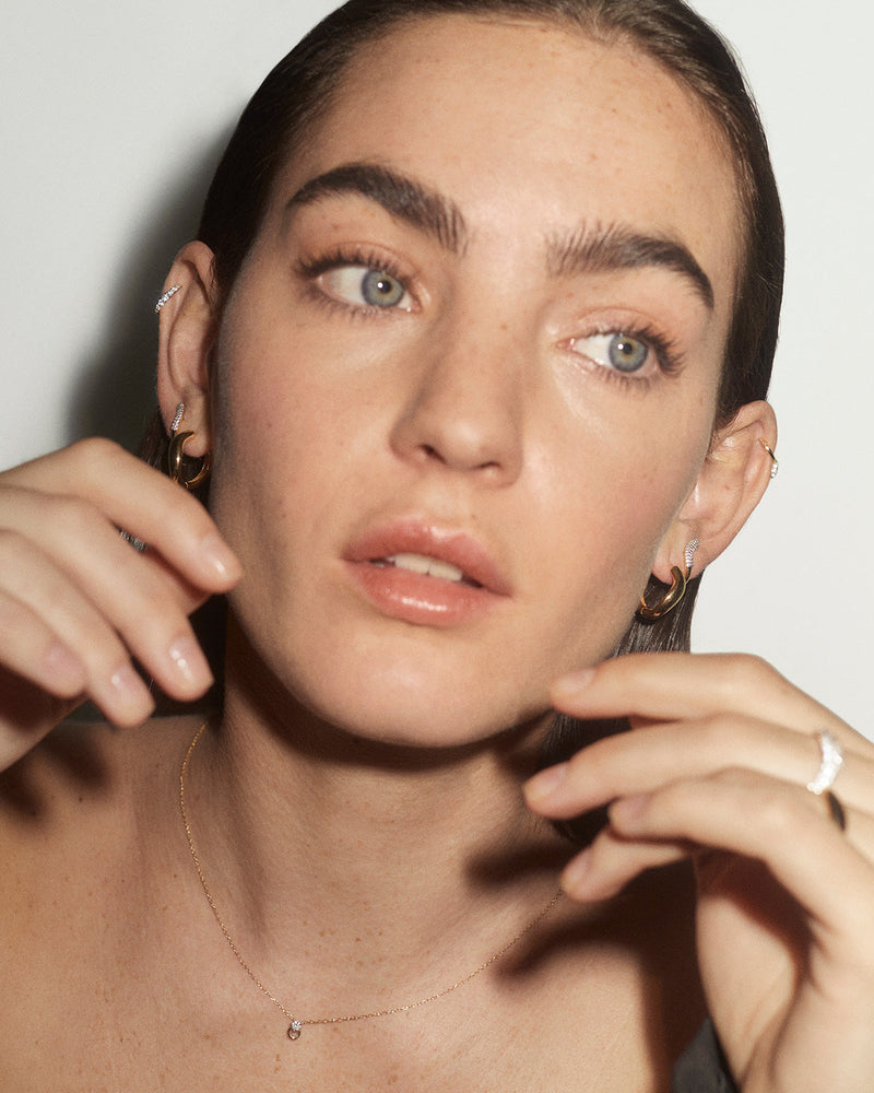 Wavy plain band hoop earrings in solid yellow gold