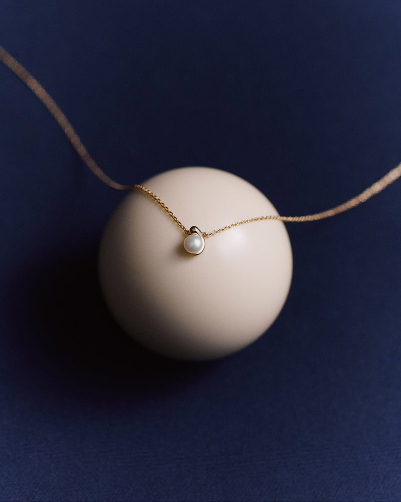 Dainty solitary chain necklace accented with an organic freshwater cultured pearl