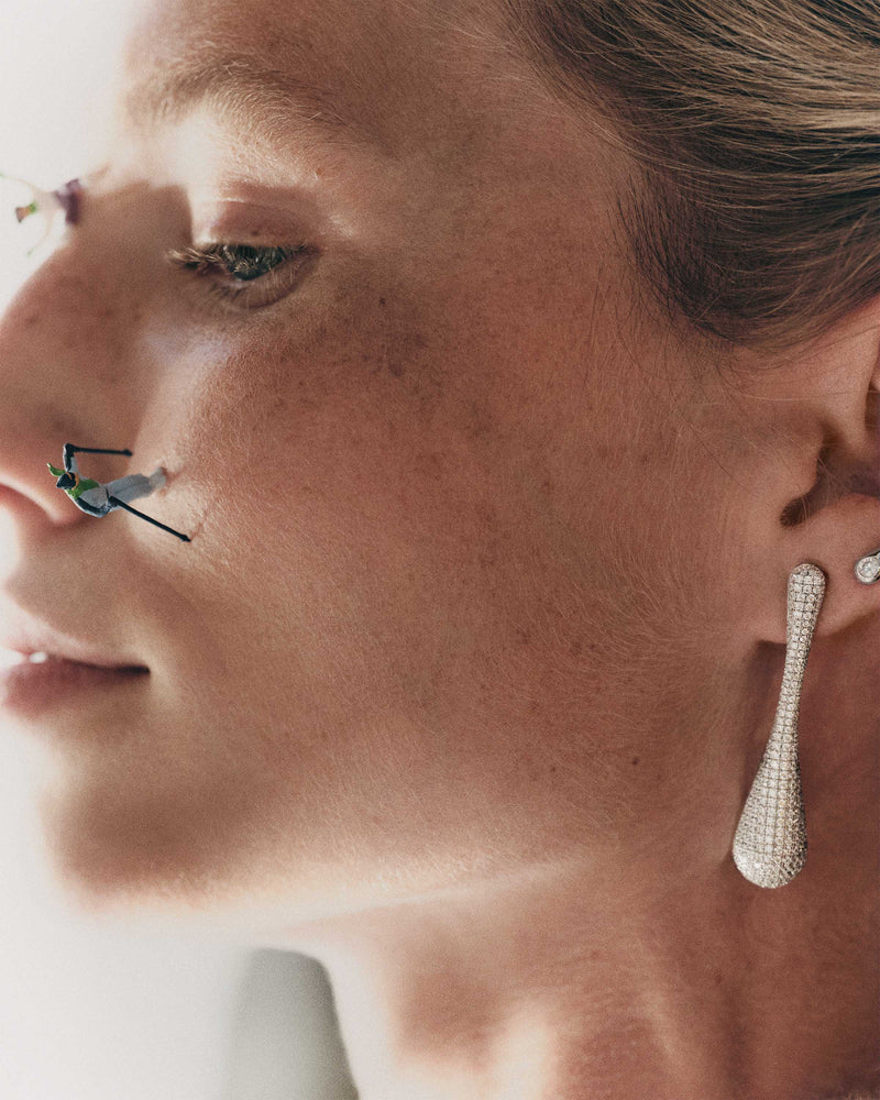 Elegant long drop earrings with pavé zirconia and sculptural design