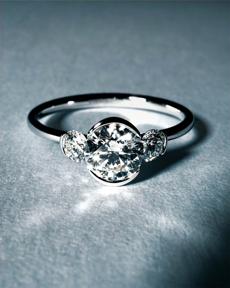 White gold trilogy ring with three round half-bezel lab-grown diamonds