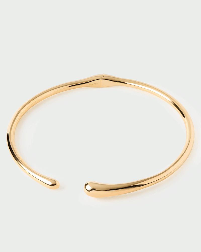 Gold-plated open choker necklace with a sculptural drop design