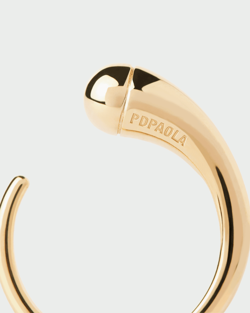 Sculptural open band ring with drop-shaped motif and rounded edges
